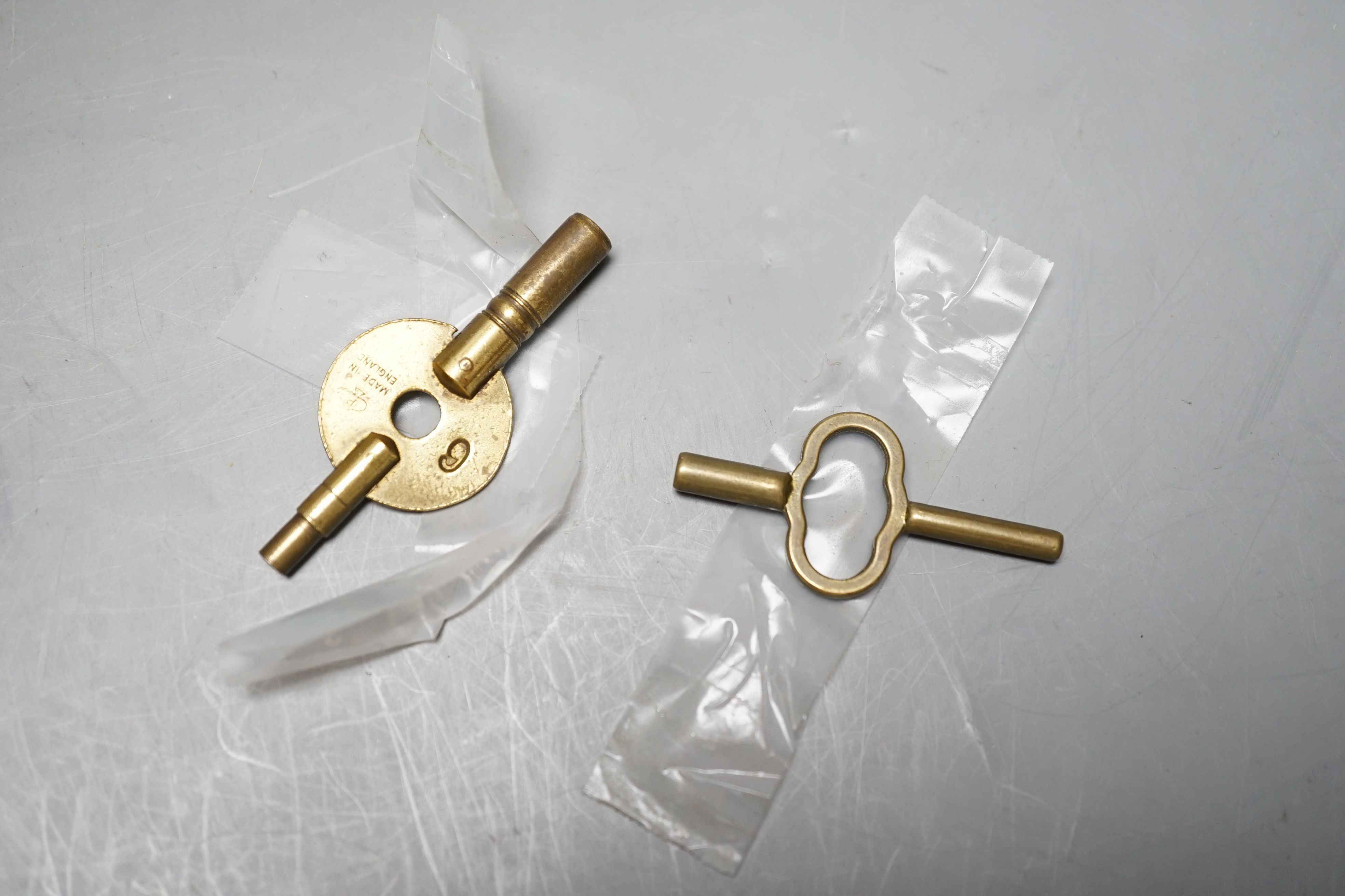 Two modern brass carriage timepieces, one oval cased